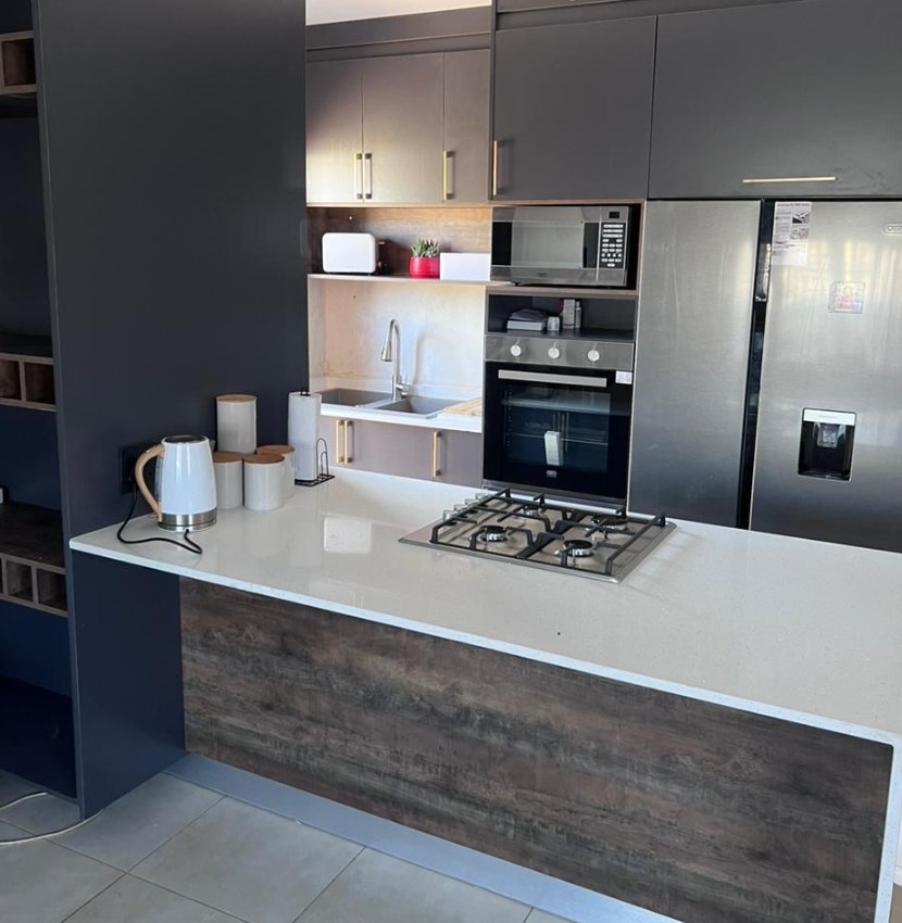 Kitchen renovation — island with white countertop